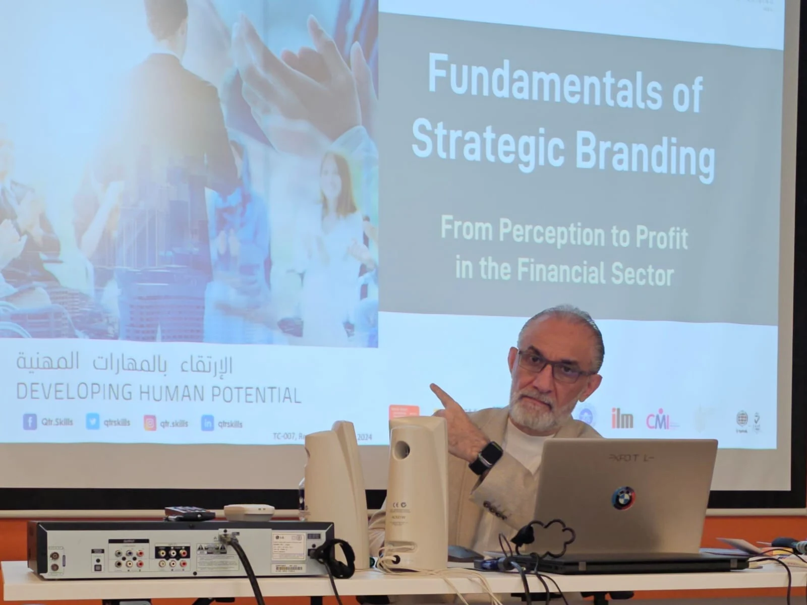 Ammar Anabtawi presenting a strategic branding course in a classroom